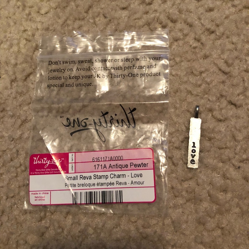 Jk thirty one reva stamp charm